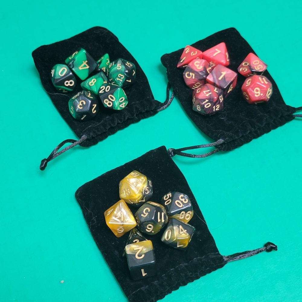 3 sets of D&D Dice: Red, Green and Yellow